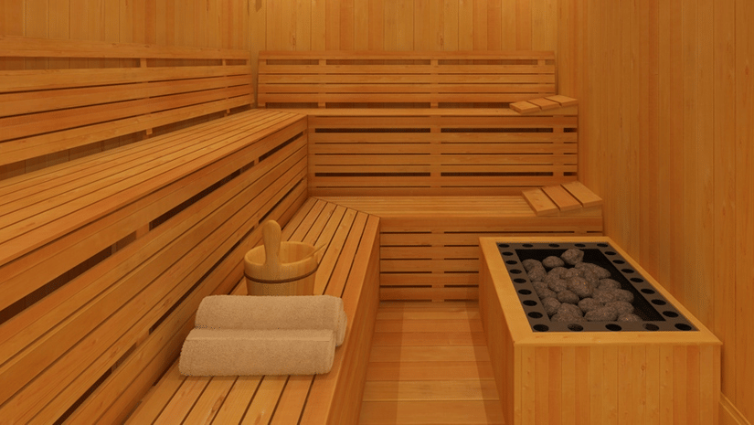 The interior of a traditional wooden sauna, showcasing its tiered benches and warm, inviting ambience