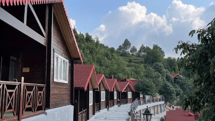Another perspective of the cottage pathway, emphasizing the tranquil ambiance and architectural appeal - Digantaa Resort in Mukteshwar